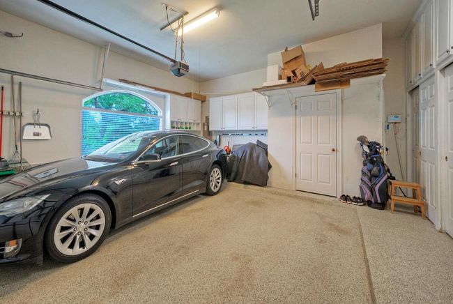 Garage featuring a garage door opener | Image 29