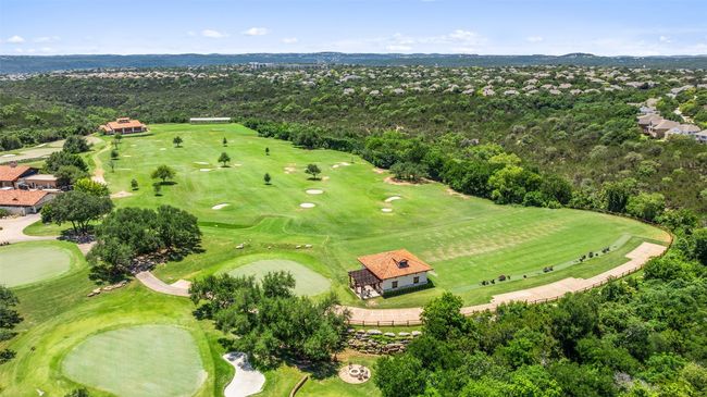 Aerial view of property and surrounding area with a golf club and a mountain backdrop | Image 40