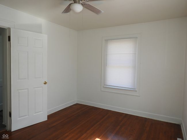 bedroom with ceiling fan | Image 10