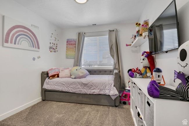 Bedroom featuring carpet floors and baseboards | Image 9