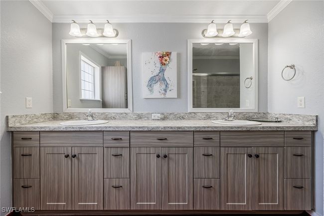 Full bathroom featuring ornamental molding, double vanity, and a sink | Image 26