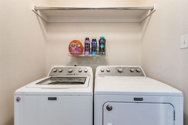 Laundry area and washer, clothes dryer and shelving | Image 16