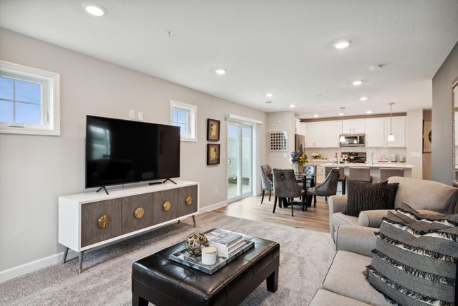 What a great floorplan! Don't miss a thing from the kitchen with this open space! A poured concrete patio is also included just outside of the dining room sliding glass door. *Photos are of another model, colors and finishes may vary. | Image 11