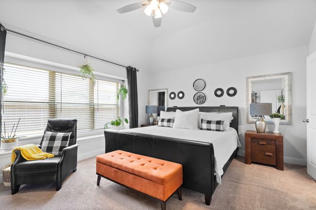 Spacious primary bedroom featuring oversized windows, plush carpeting, and a walk-in closet! | Image 17