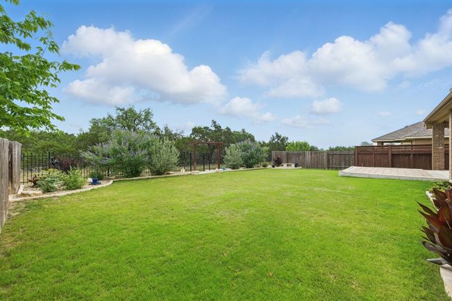 A wrought-iron gate leads directly to scenic walking trails, offering easy access to nature. | Image 32