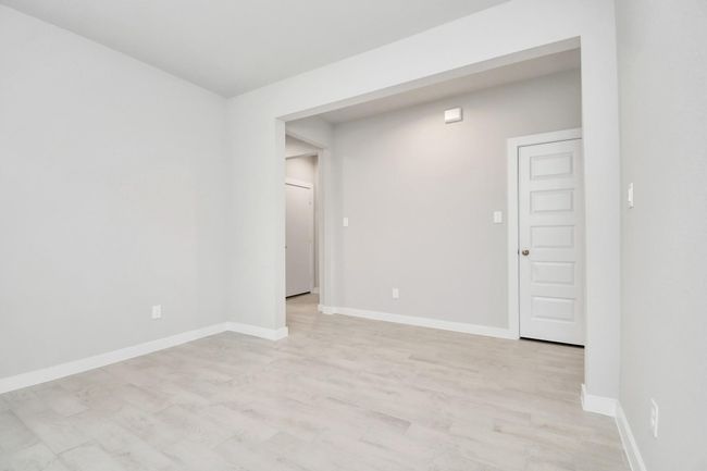Discover another perspective of the spacious dining room. | Image 12