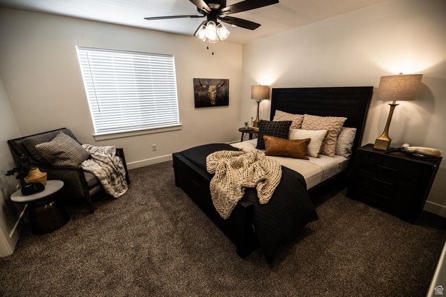 Carpeted bedroom featuring baseboards and ceiling fan | Image 5