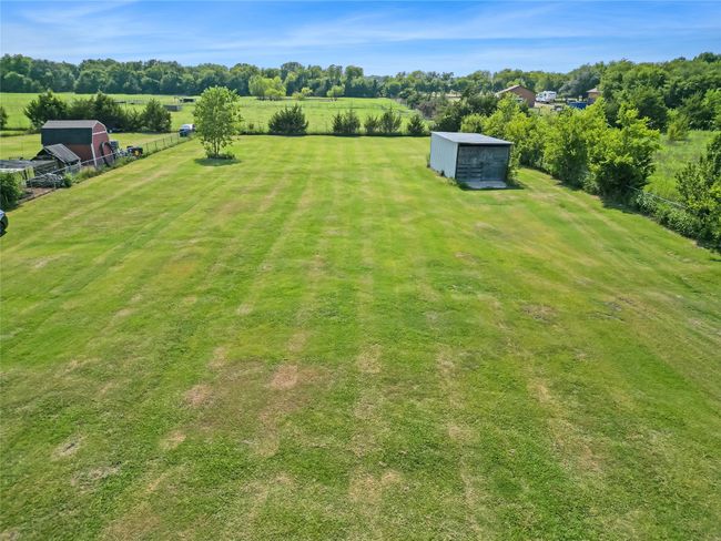 View of yard with an outbuilding | Image 21