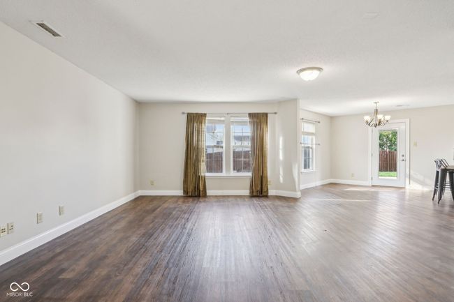 This is a home you will need to really walk through to grasp the potential, this Family Room at the back of the home allows for casual lounging, not too far from the kitchen! | Image 15