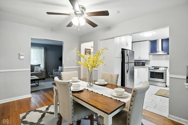 dining room featuring light wood-style floors and ceiling fan | Image 11