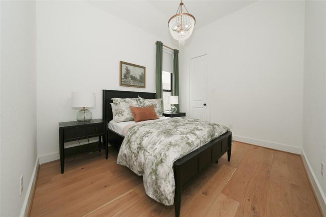 Inviting guest suite with elegant finishes and ample natural light. | Image 27