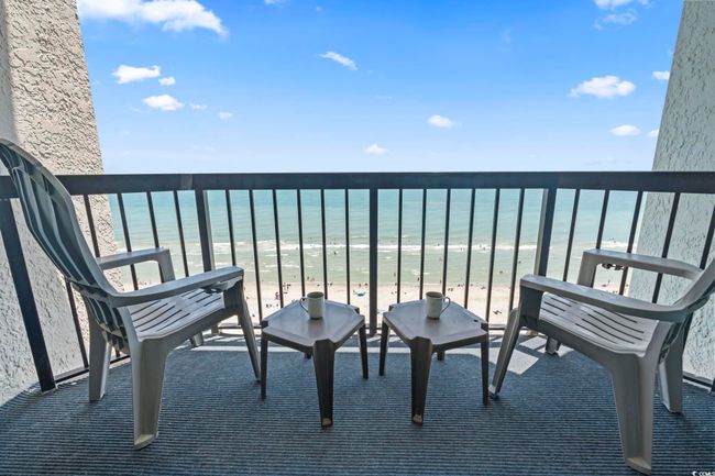 Balcony with view of water and beach | Image 18