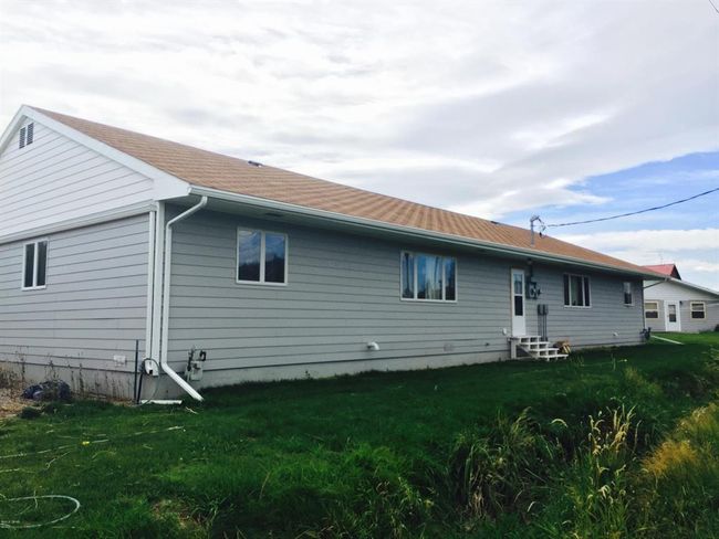 Back of house featuring a yard and rear entry steps | Image 6