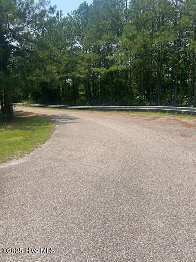 Ponds Brother Road headed to entrance to Property. | Image 11