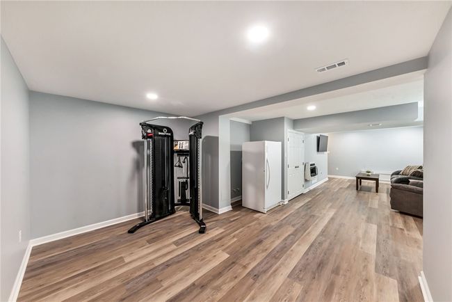 This area could easily be home to a a pool table or your gym equipment. | Image 36