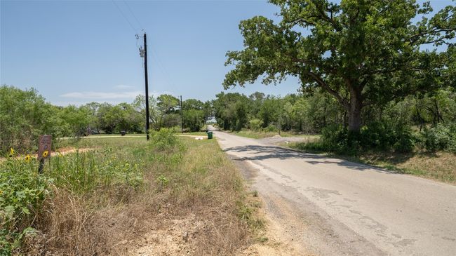 View of asphalt road featuring a forest view | Image 7