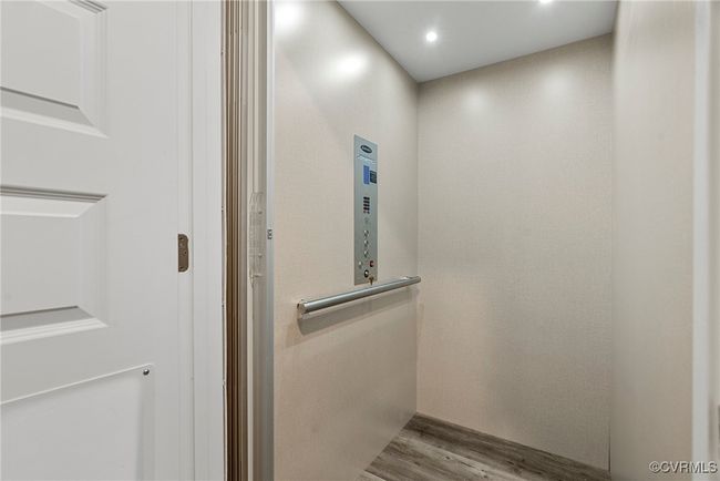 Interior details with elevator and wood-type flooring | Image 36