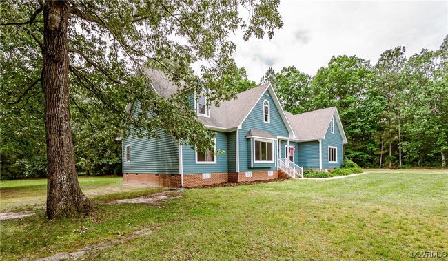 Cape cod home with crawl space, a front yard, and roof with shingles | Image 49