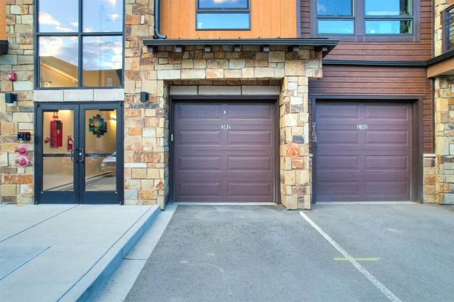 Garage featuring driveway and french doors | Image 35