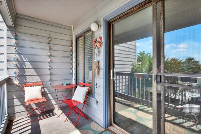 Balcony with Sunset & Partial Water Views! | Image 22
