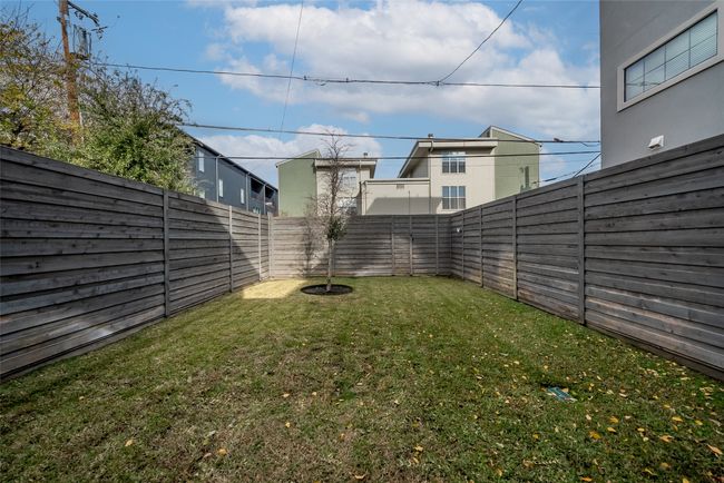 View of fenced backyard | Image 34