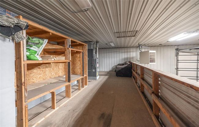 Storage featuring a garage and heating unit | Image 21
