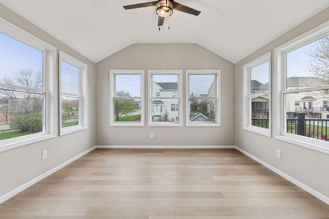 Sunroom with plenty of light and backyard views | Image 8