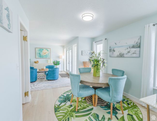 Dining area with light wood-style floors, french doors, and baseboards | Image 27