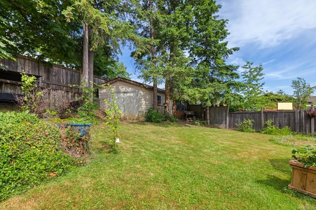 REAR YARD LAWN AND PRIVACY FENCE INCLUDES A STORAGE SHED | Image 26