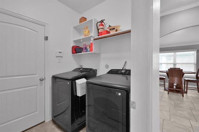 Laundry room off of garage entrance | Image 22