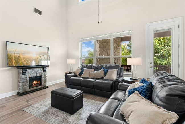Beautiful two story living room with windows and light. Perfect for large gatherings. | Image 8