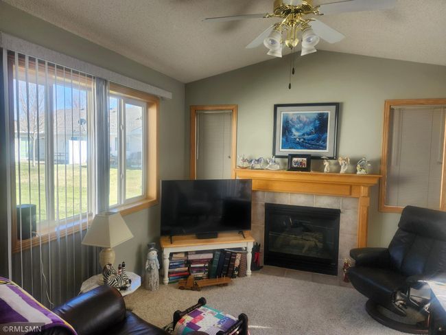 sunroom fireplace view | Image 7