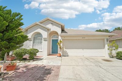 10232 Oasis Palm Drive, House other with 3 bedrooms, 2 bathrooms and null parking in Tampa FL | Image 1