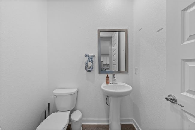 Half bathroom featuring baseboards and toilet | Image 32