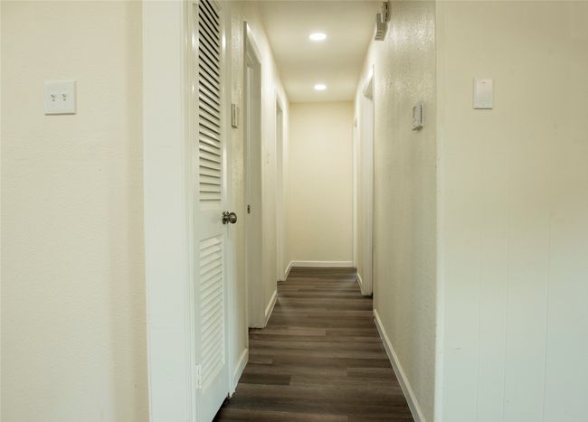 Hall featuring dark hardwood / wood-style floors | Image 7