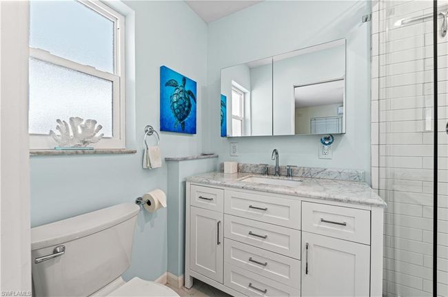 Bathroom featuring vanity and toilet | Image 15