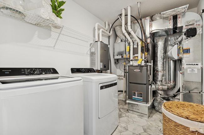(Photo of decorated model, actual home's finishes will vary) Mechanical and laundry room. | Image 16