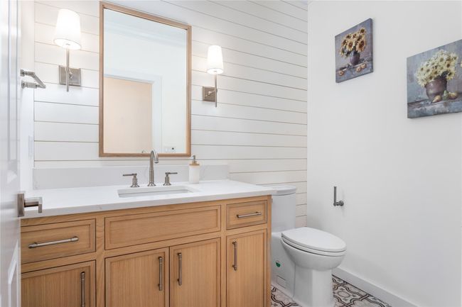 Bathroom featuring toilet and vanity | Image 11