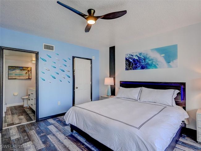 OWNER'S SUITE SHOWING ENTRANCE TO EN-SUITE BATH. CLOSED DOOR LEADS TO WALK-IN CLOSET. | Image 23