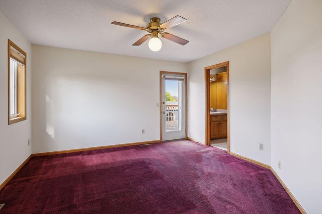 Main floor primary suite with deck access | Image 19