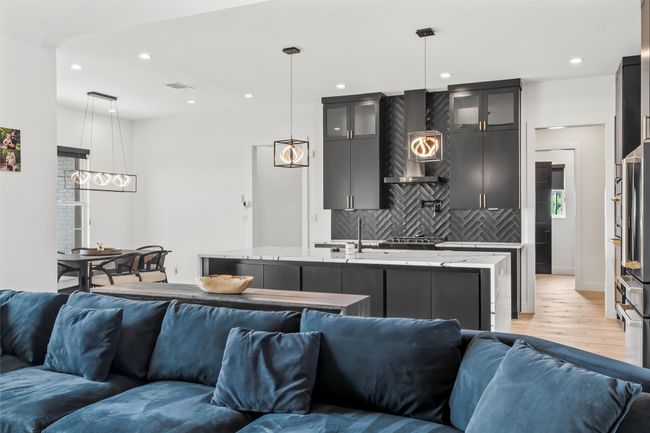 Living room featuring visible vents, light wood-type flooring, and recessed lighting | Image 8