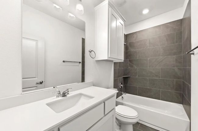 Bathroom with vanity, bathing tub / shower combination, and recessed lighting | Image 6