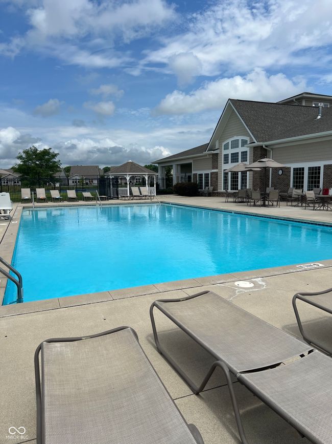 community pool and a patio area | Image 27