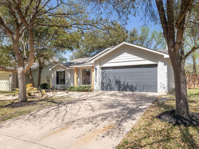 Ranch-style home with concrete driveway and an attached garage | Image 26