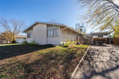 View of property exterior with a yard | Image 1