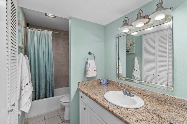 Full bathroom with deep closet and granite counters | Image 15
