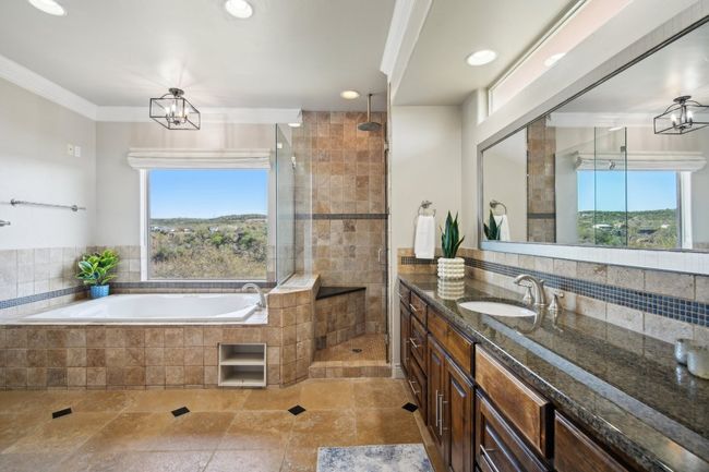 Full bath featuring recessed lighting, a shower stall, crown molding, a bath, and vanity | Image 23
