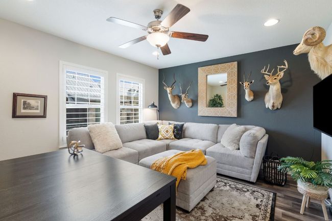 1st Floor Bedroom #2 used as an Office/Living Room featuring wood finished floors and a ceiling fan | Image 28