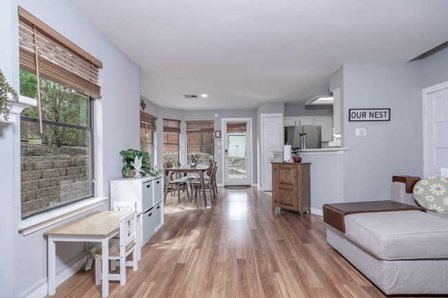 Living area with baseboards, light wood-style floors, visible vents, and recessed lighting | Image 9