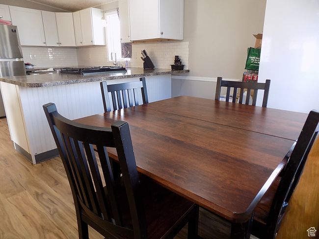 Dining area with sink and light wood-type flooring | Image 9